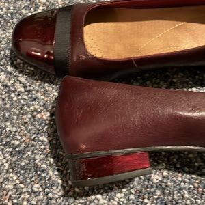 Burgundy Clark flats with patent tip.